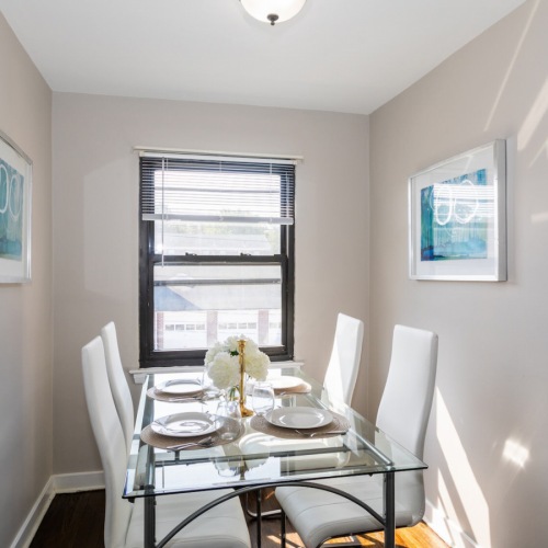 Dining Area  Large dining room with wood floors and large windows